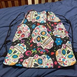 New sugar skull drawstring backpack. 16.5 inches wide by 19.5 inches tall